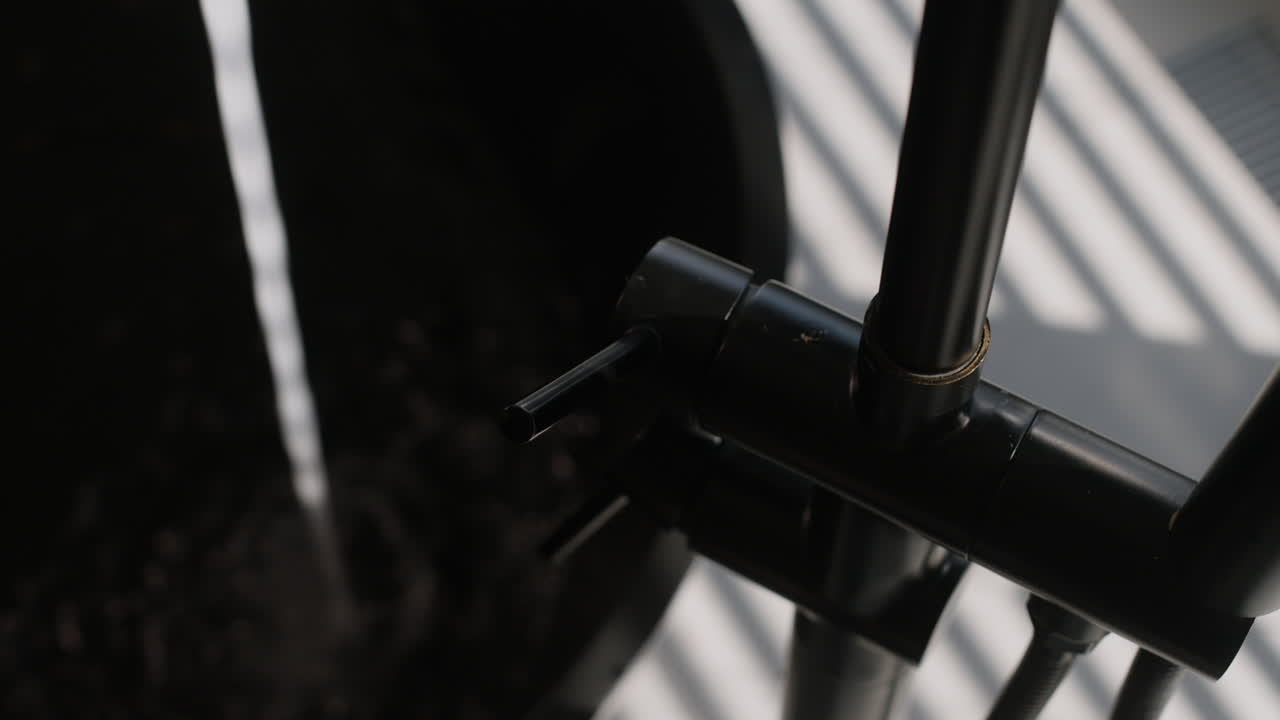 Close-up of a black modern bathroom faucet