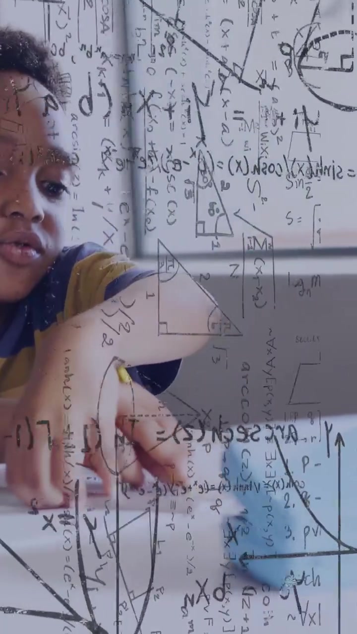 Vertical video: Boy reaching toward blue robot, nudging it across paper while studying math overlay