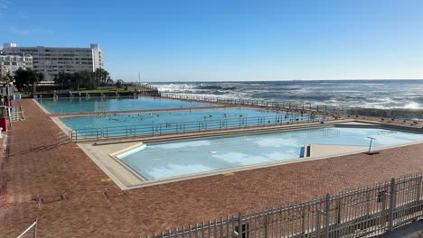 sea point swimming pool on a sunny winter’s day in sea point, cape town