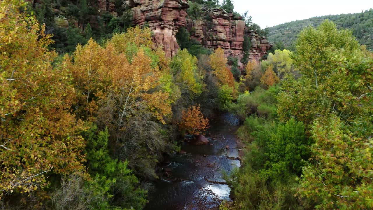 Sycamore Creek flowing through Arizona's roaming desert with trees turning orange lining its shoreline