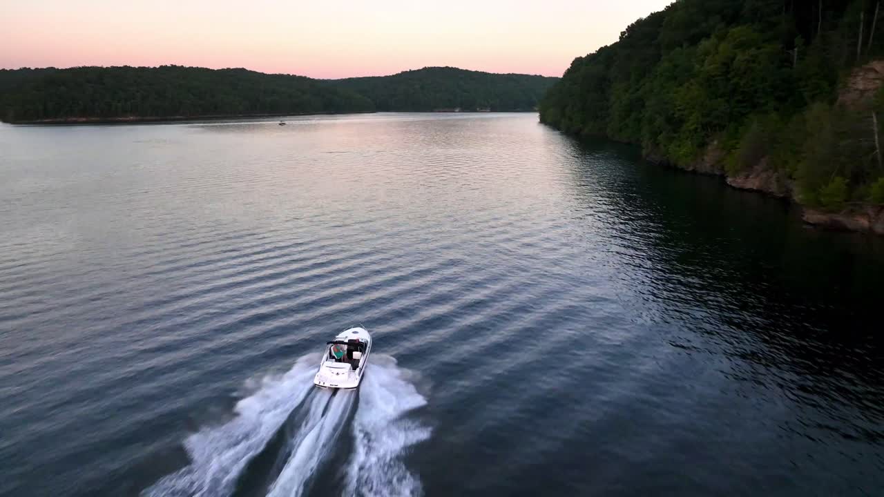 Boat travels at high speed aerial on Summersville Lake and Reservoir in West Virginia