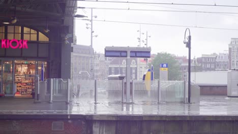 amsterdam train station in the rain 2