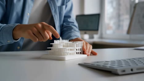 person interacting with an architectural 3d model