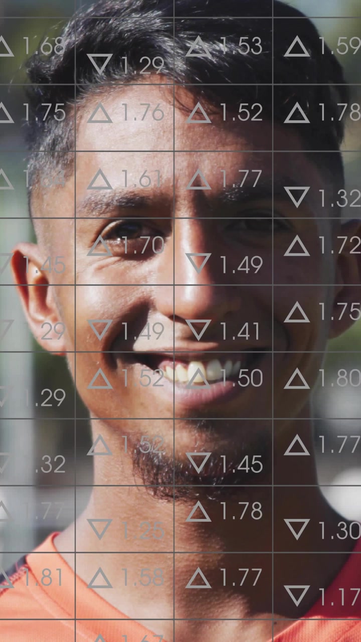 Male athlete facing camera smiling wider as recording starting, data grid analyzing smile for sport