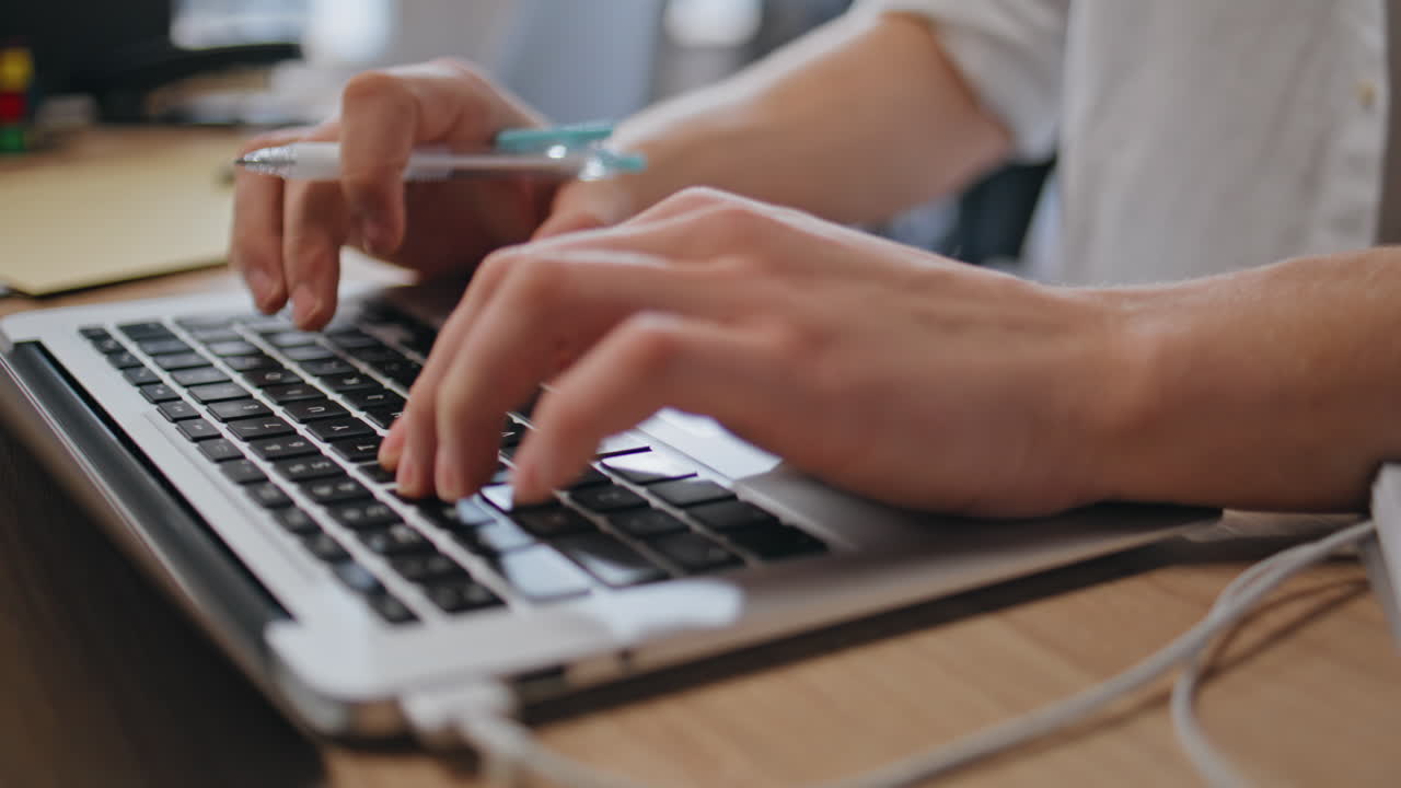 Freelancer hands typing laptop keyboard at cabinet closeup. Businessman working