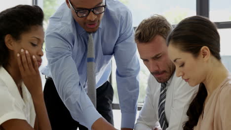 businesspeople working together around a table