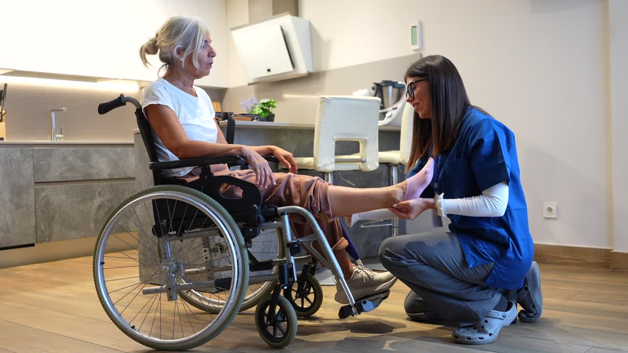 Elderly woman receiving physical therapy at home