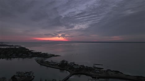 an aerial view over five islands park in new rochelle, ny at sunrise