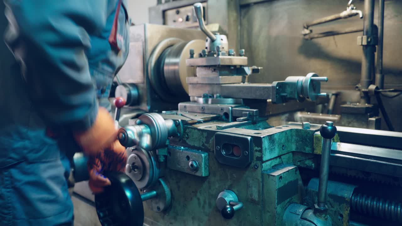 Modern lathe-cutting machine with manual control. Metalworking equipment.