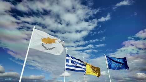 a dynamic display of flags including the cypriot, greek, and ukrainian flags against a vibrant sky with dramatic clouds