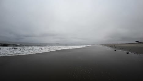 low altitude flight over huntington beach, california on a foggy, overcast morning