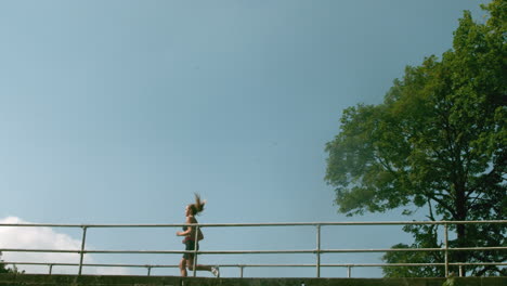 motivated woman in sportswear running