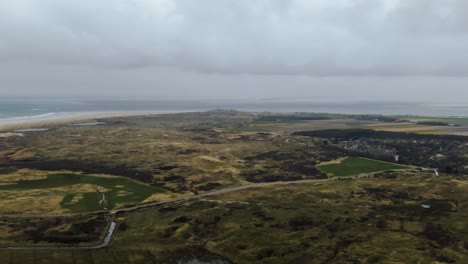tracks between salt marshes on countryside of texel island at north holland, netherlands. - aerial shot