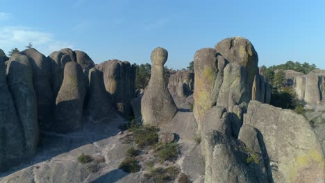 Aerial-shot-passing-over-rock-formations-in-El-Valle-de-loss-Monies,-Copper-Canyon-Region,-Chihuahua