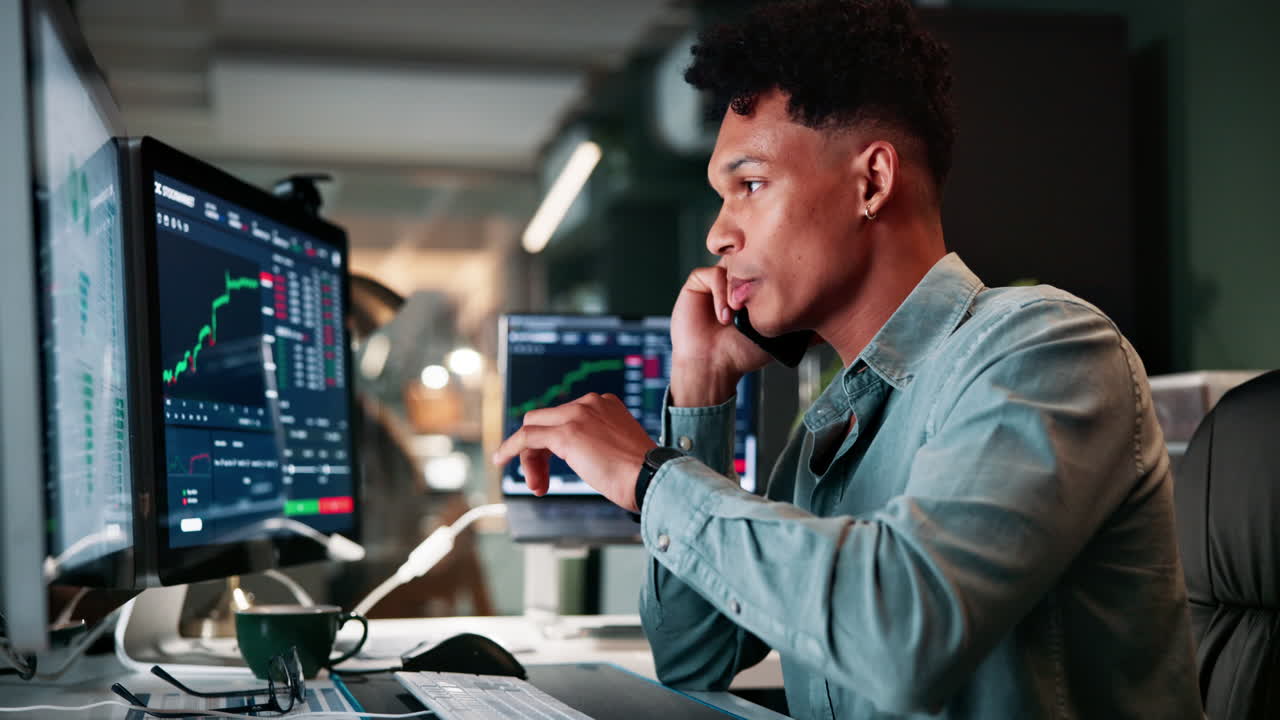 Businessman working on stock market data at night
