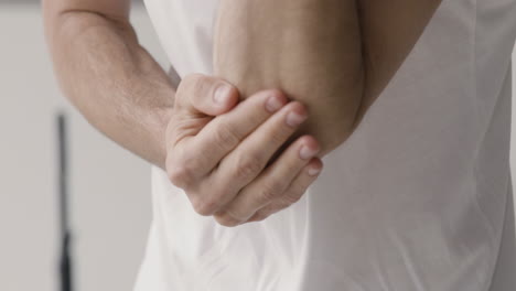 close up of a man having elbow pain