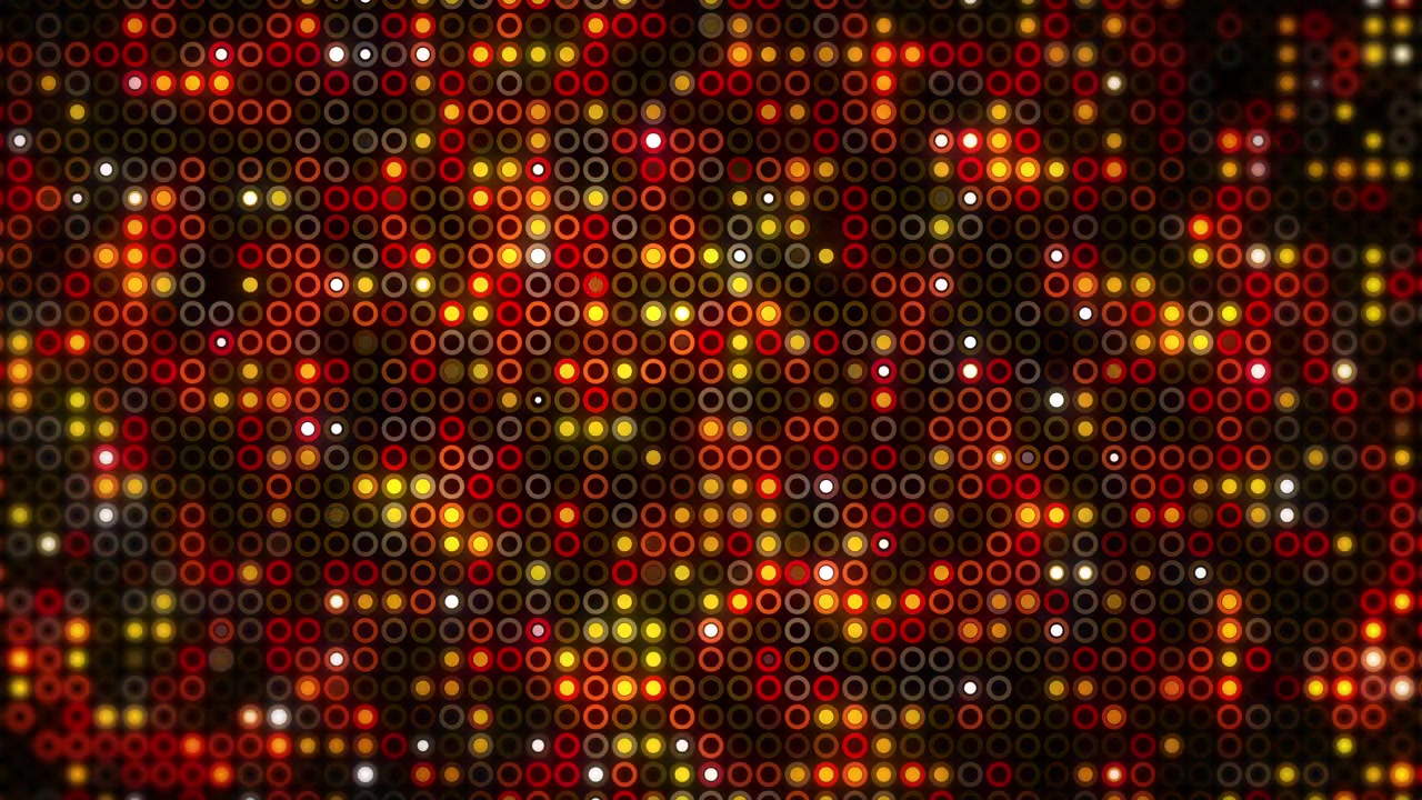 A vibrant horizontal background filled with a dense pattern of small circular rings illuminated with bright orange, red, and yellow glowing lights digital billboard. Loop animation.