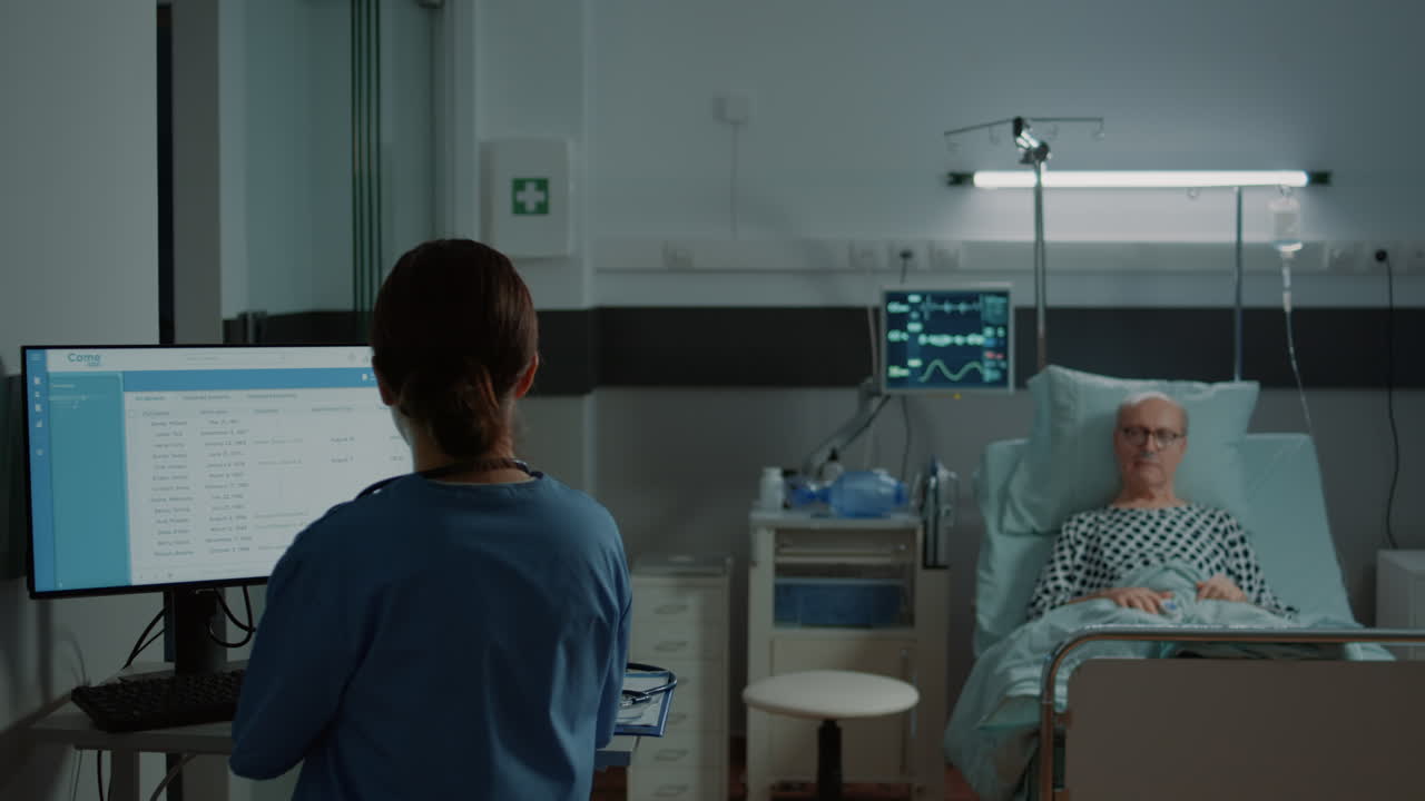 Nurse examining medical results on computer for patient