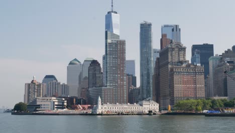 slow motion landscape of new york city manhattan buildings towers skyscrapers skyline from the battery park hudson river usa america travel tourism waterfront boardwalk