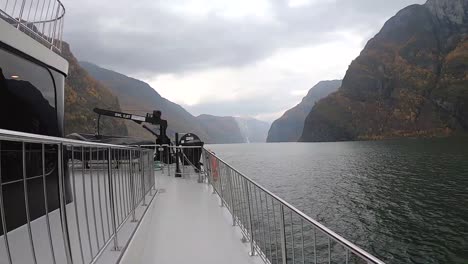 walking on the deck of a ship in the norwegian fjords