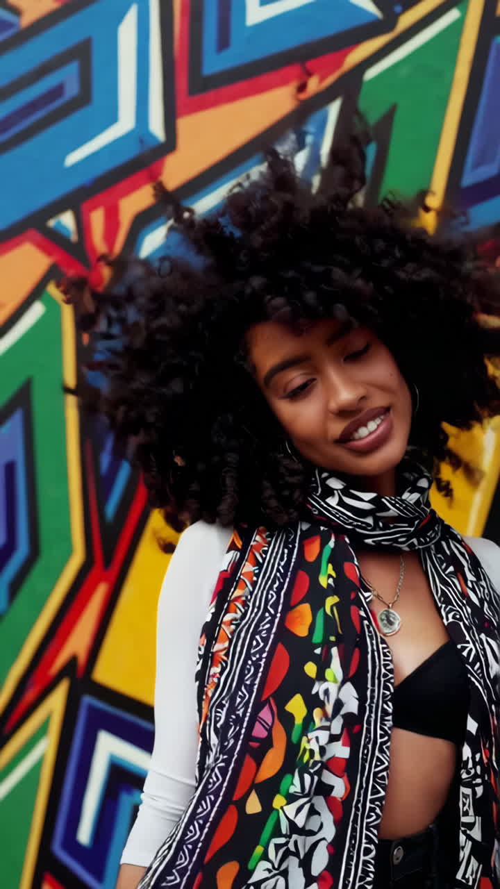 Stylish Woman Posing Against Graffiti Wall