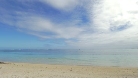 beach with deck-chairs on tropical resort