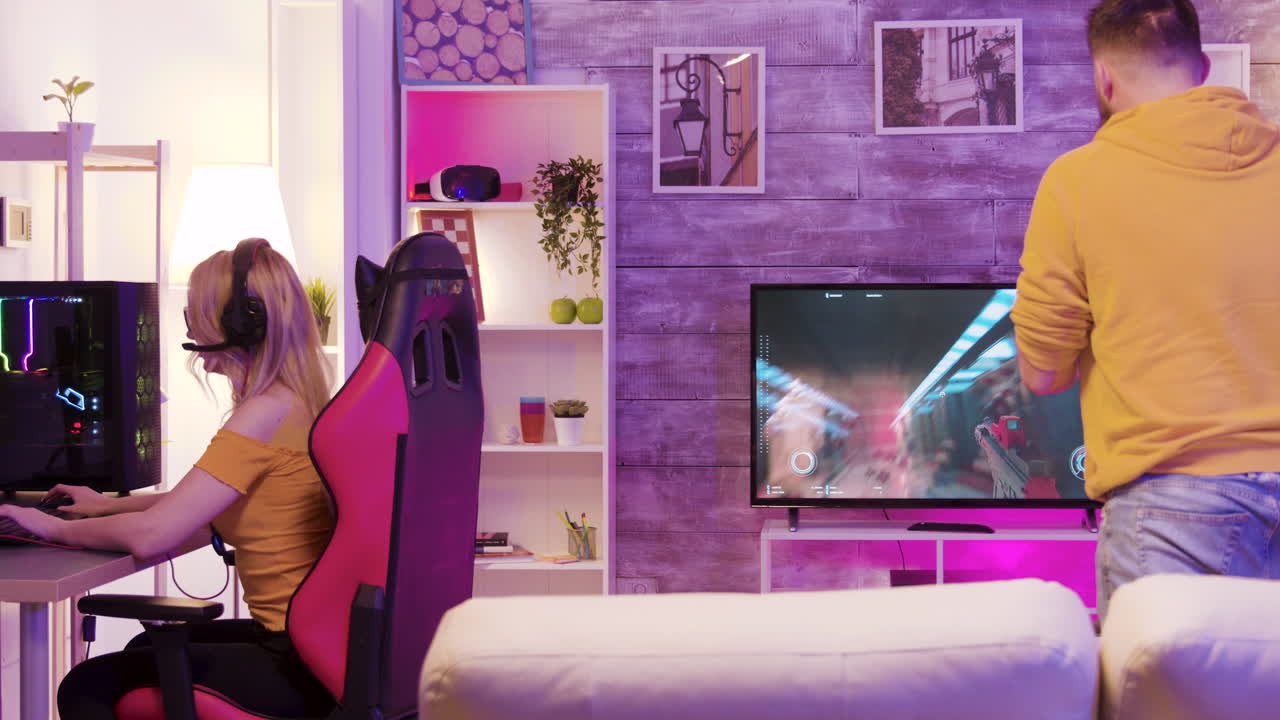 Gamers Playing Video Games Together in Living Room