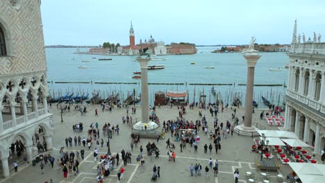 4K-Aerial-of-San-Marco,-the-Rialto-Bridge,-and-the-canals-in-Venice,-Italy-on-a-cloudy-day-12