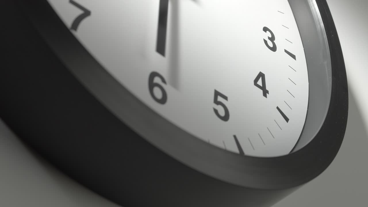 Clock Face in Time Lapse on White Wall in Office