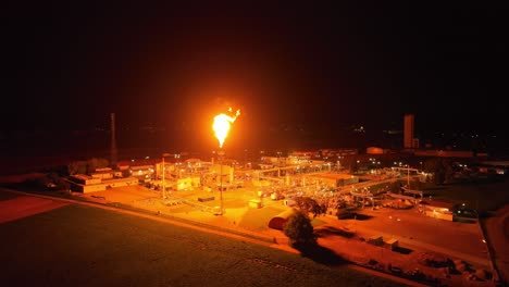 Gas-Flaring-Illuminates-the-Surrounding-Area-With-its-Radiant-Light---Orbit-Drone-Shot