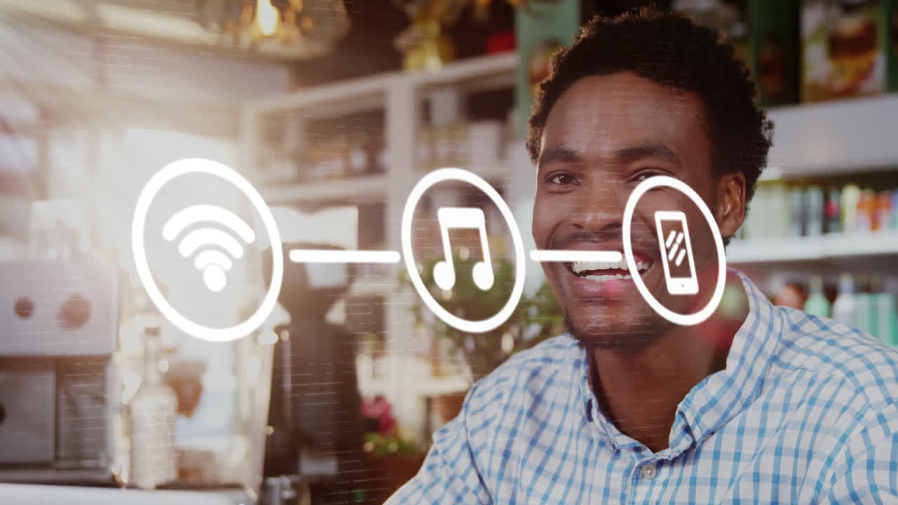 animación de diagrama de flujo de iconos sobre hombre biracial sonriente desplazándose en el teléfono inteligente