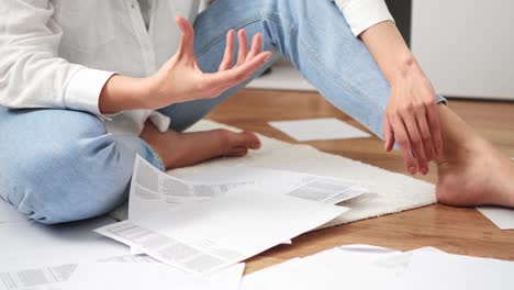 lawyer lawyer girl sits on the floor working. angry lawyer gestures of displeasure. aggression