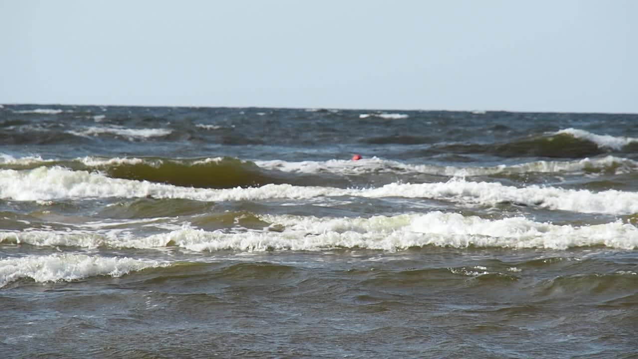 Wavy Baltic Sea on Latvian Coast. Cold Water and Waves Under Evening Winter Sun