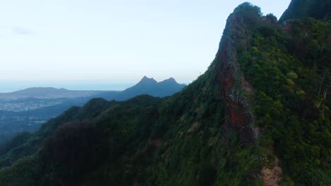 Aerial-dolly-left-shot-of-Koolau-mountain-revealing-Kaneohe-city,-Hawaii,-USA