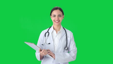 Happy-Indian-female-doctor-listening-to-patient-Green-screen