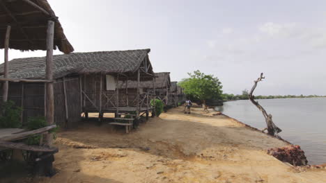 local town shack houses with tourists waiting at senegal africa