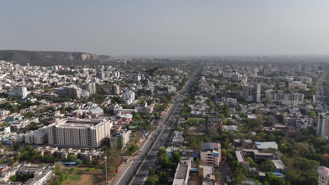 Aerial shot of Jaipur Pink city with traffic and urban buildings