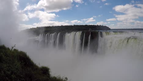 huge waterfall in argentina covering the landscape in white mist from the thunderous force of the fall