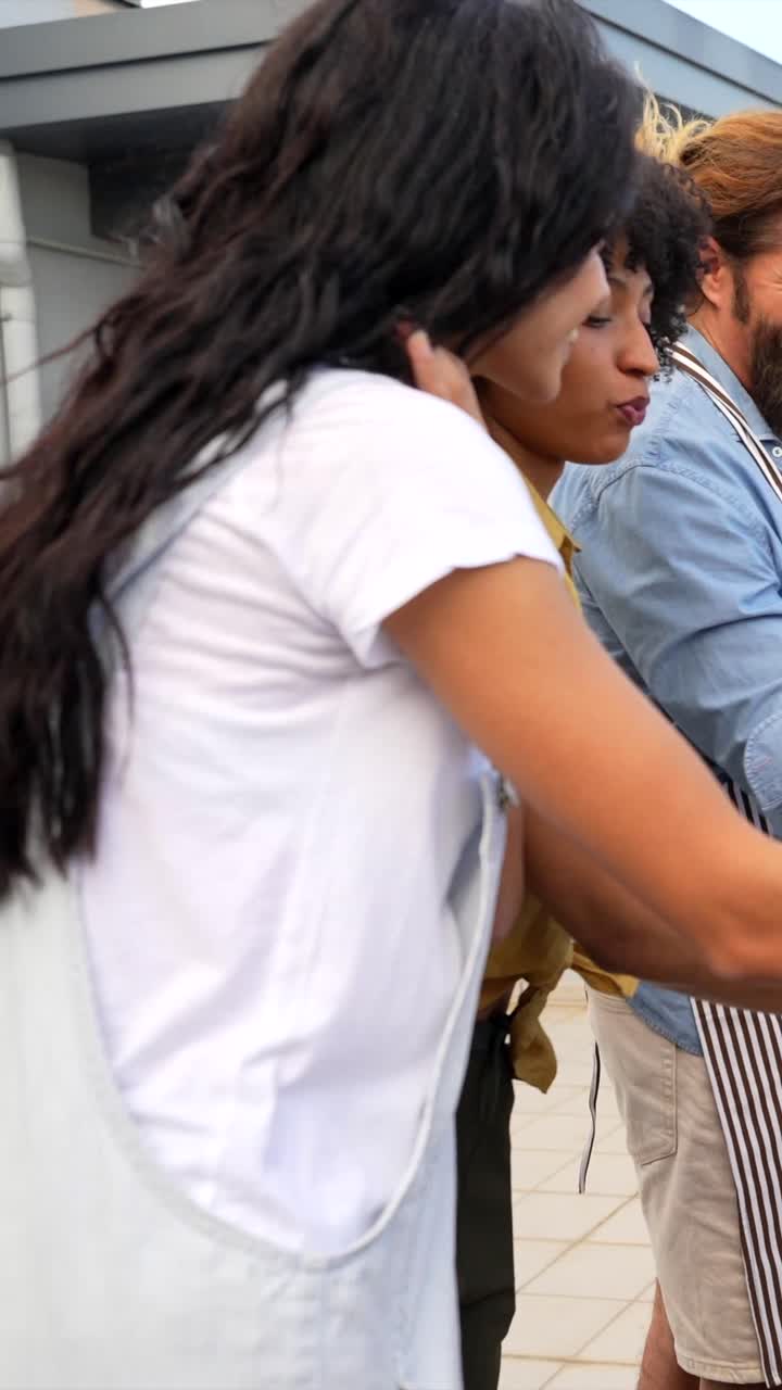 Friends grilling marshmallows at a barbecue