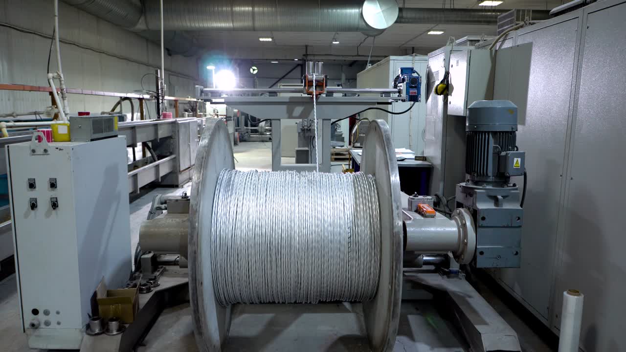 an electrical cable in isolation is wound on a metal coil