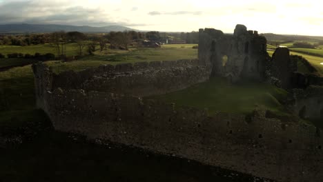 aerial view of castle ruins in the irish countryside