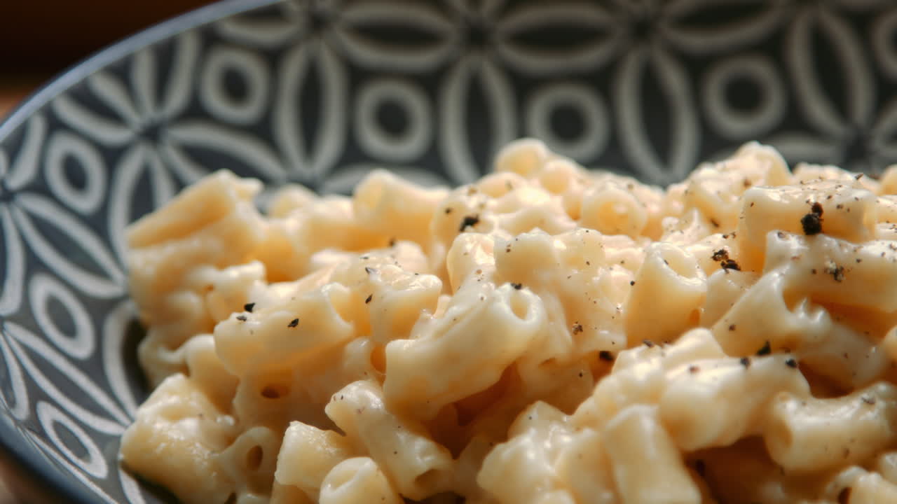 Slow Close Up Pan Acorss Macaroni Cheese Meal with Pepper