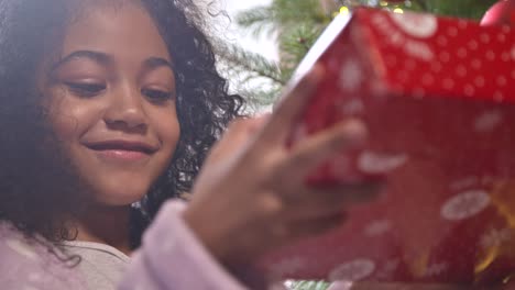 girl reading label on a gift