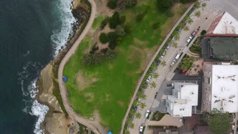 Down-facing-drone-flyover-of-La,-Jolla-San-Diego-coastline