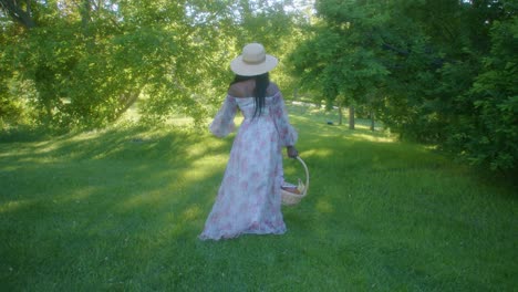 black woman with basket walking into park following circling