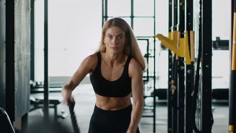 woman exercising with cable machine in gym