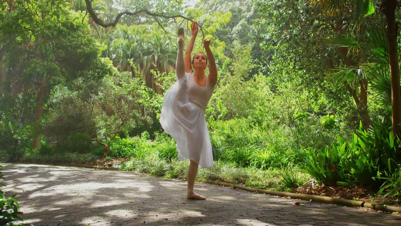 Young ballerina dancing in the park 4k