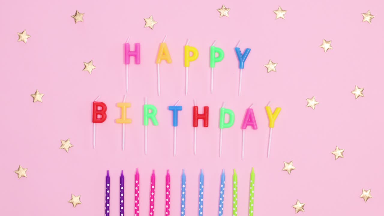 Happy birthday stop motion. colorful candles and candles with Happy birthday text appear on pastel pink theme