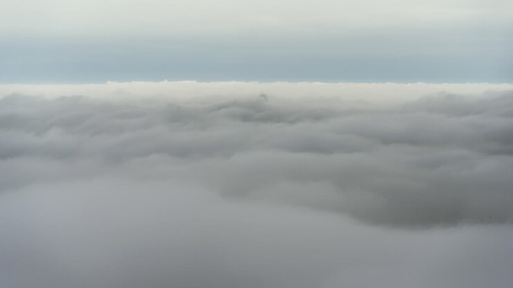 Timelapse mountain peak above the clouds blue horizon sea of clouds