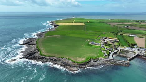 Ireland-Epic-locations-drone-landscape-of-the-tip-of-Hook-Head-Peninsula-graveyard-of-a-thousand-ships-in-Wexford-on-a-summer-afternoon